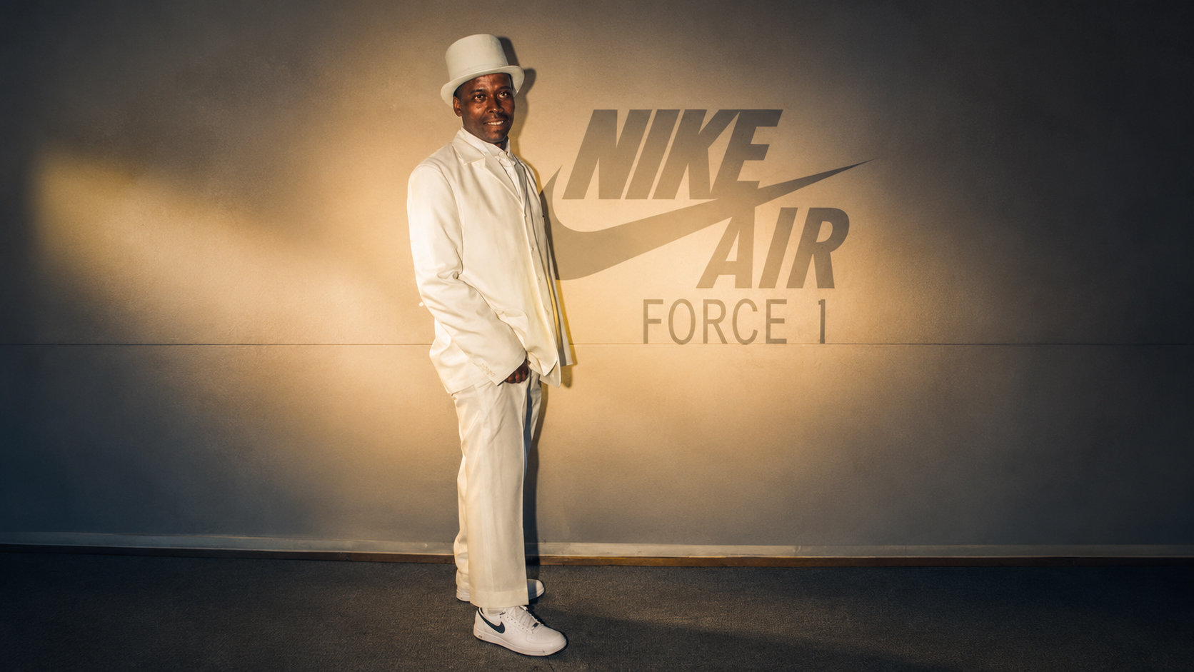 One of the private VIP butlers welcomes guests into the Nike X MTV Air Force 1 25th anniversary experience, dressed head-to-toe in white against the iconic Air Force 1 mark — setting the tone for an immersive night of style, culture and celebration. ©Jandré Louw