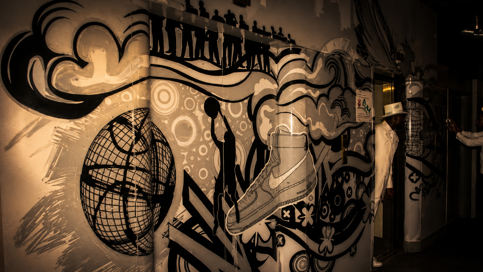 Street art meets sneaker heritage — a bespoke graffiti installation transforms the Nike X MTV Air Force 1 25th anniversary space, weaving iconic sneaker imagery, urban expression and Johannesburg street culture into the immersive experience. ©Jandré Louw