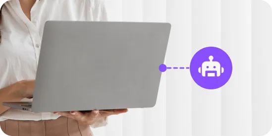 Person holding a laptop with a purple chatbot icon connected by a dotted line on the right.