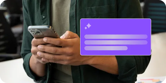 Person in green shirt holding a smartphone with a purple digital notification on the side.