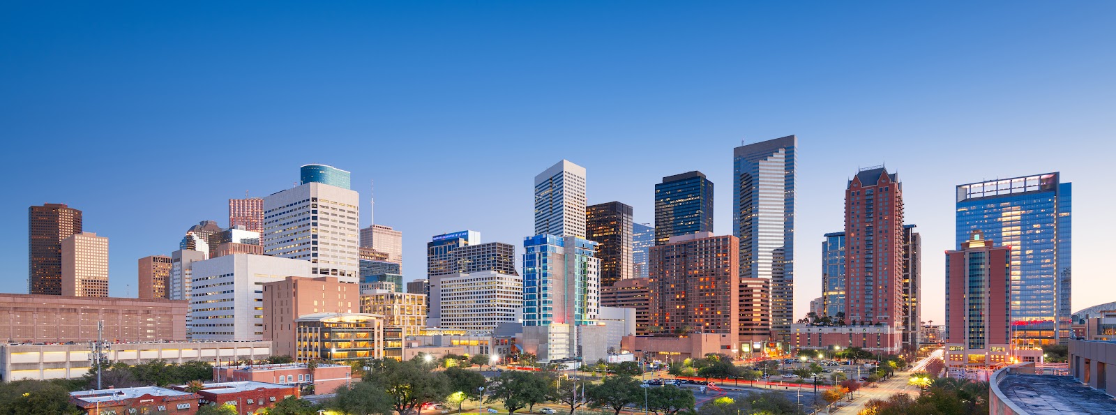 Houston Texas downtown park skyline at twilight - construction noise barrier solutions