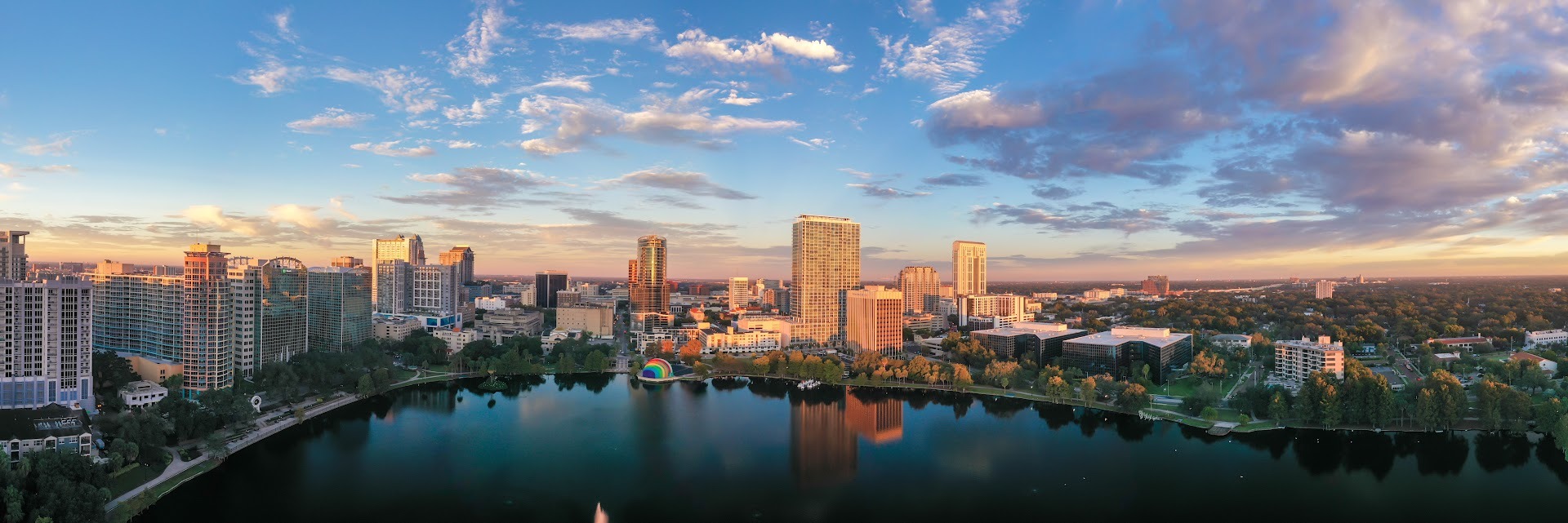Downtown Orlando skyline at sunrise with dramatic sky over Central Florida