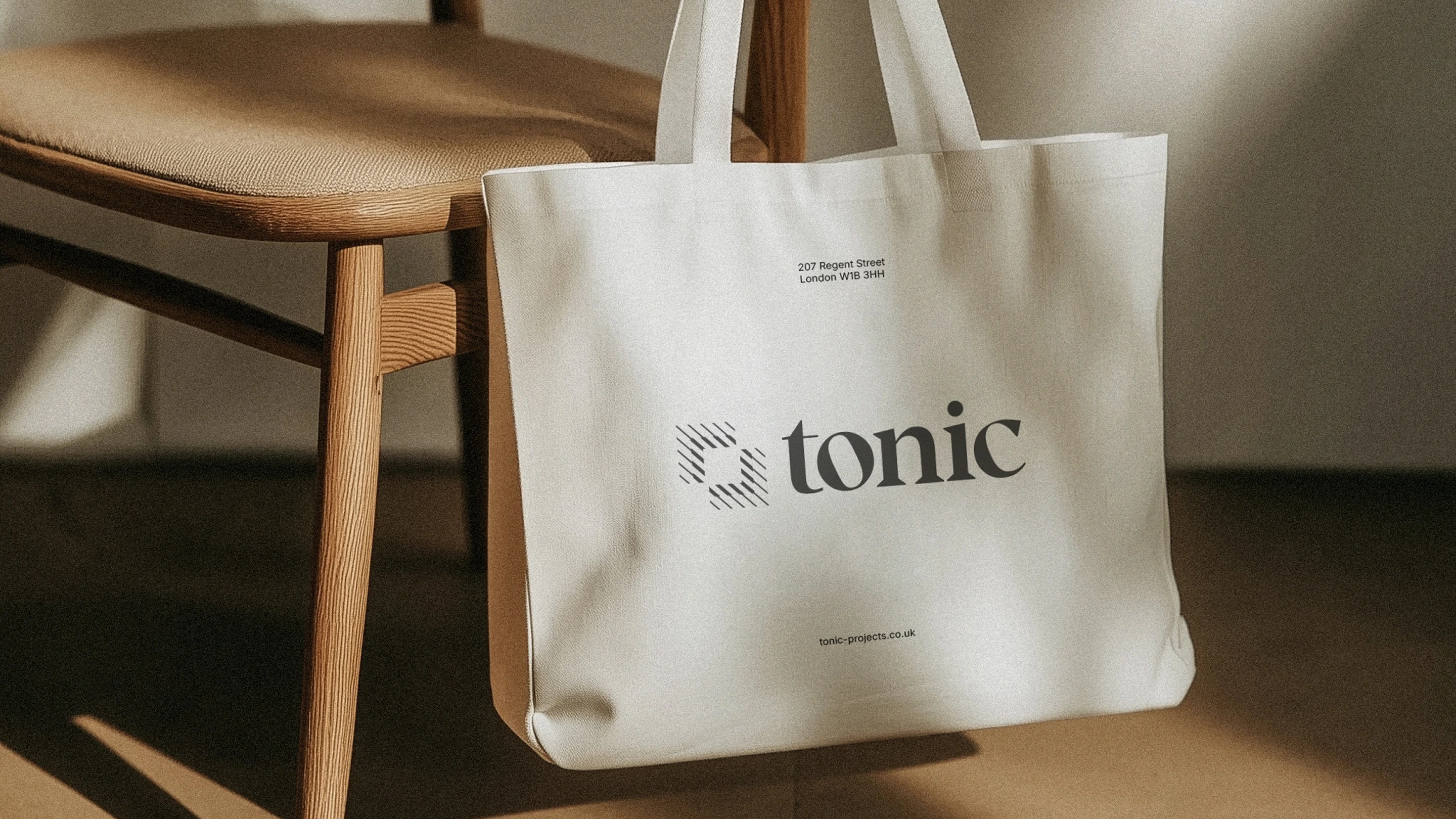 Tonic tote bag design over a wooden chair