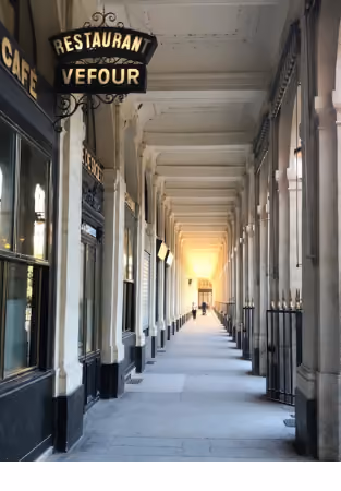 Covered passageway with columns and vaulted ceiling, illuminated sign reading "Restaurant Vefour" and "Café" on the left-hand side.