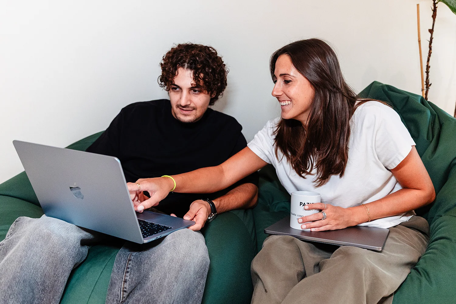 two colleagues looking at a monitor