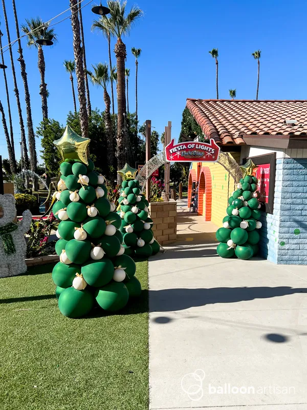 Balloon christmas tree columns for a company party.