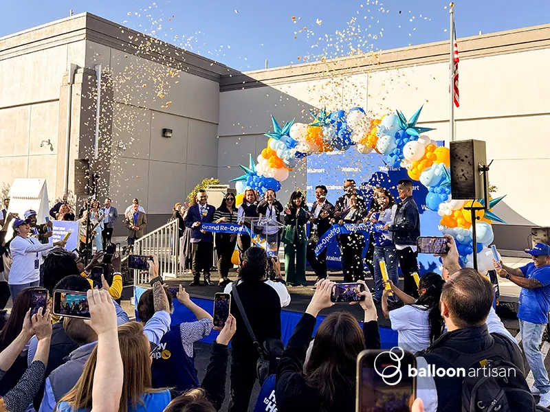A balloon arch for a grand opening ribbon cutting ceremony for a brand launch.