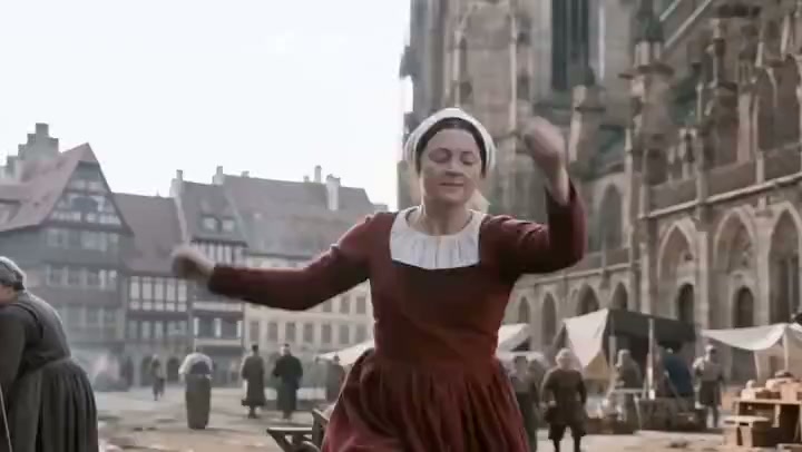 A dancer in the streets of Strasbourg in The Dancing Plague