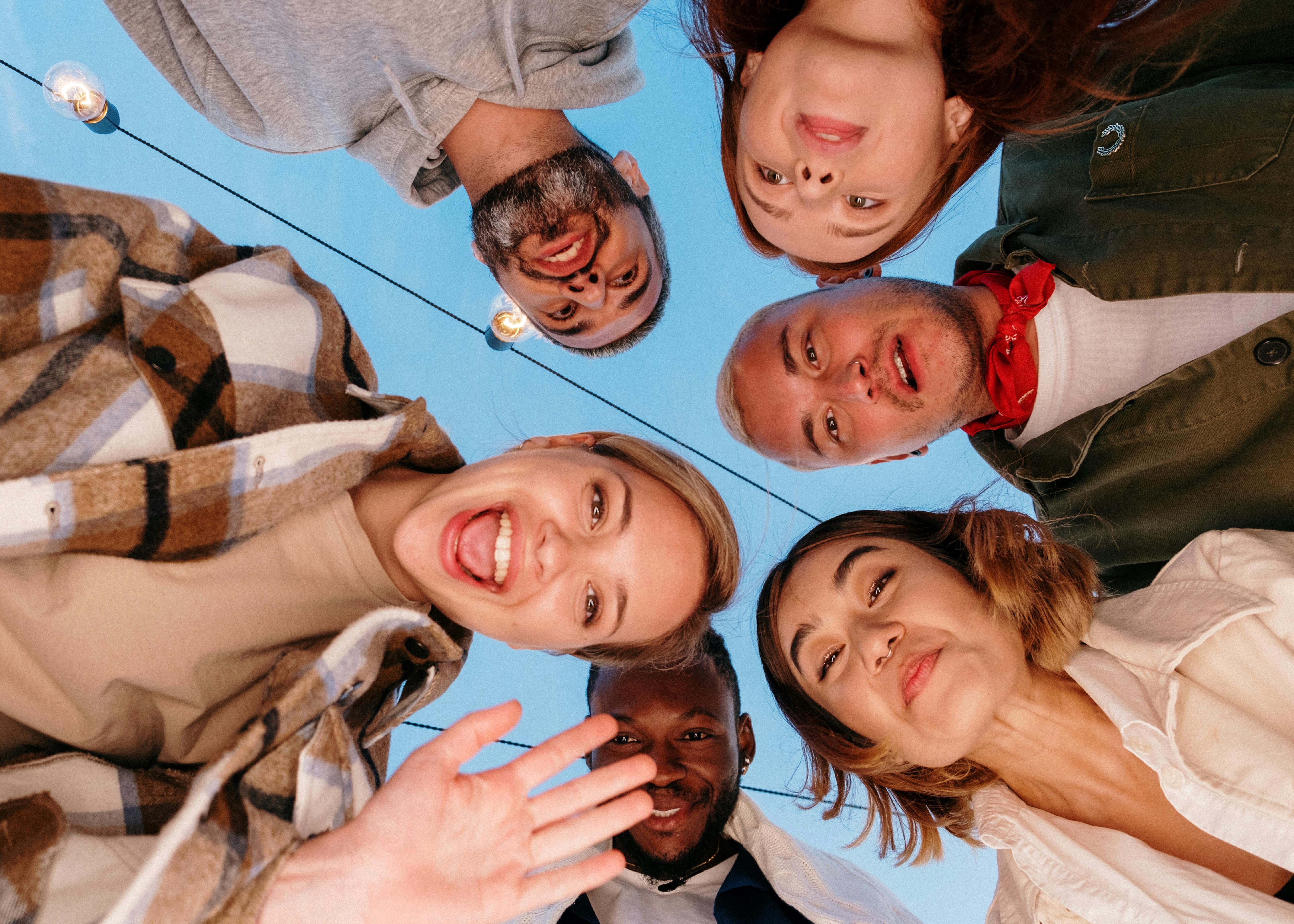 A group of people looking down at the camera