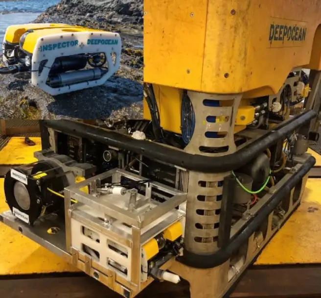 Yellow DeepOcean robotic underwater device with protective frame and mechanical components.