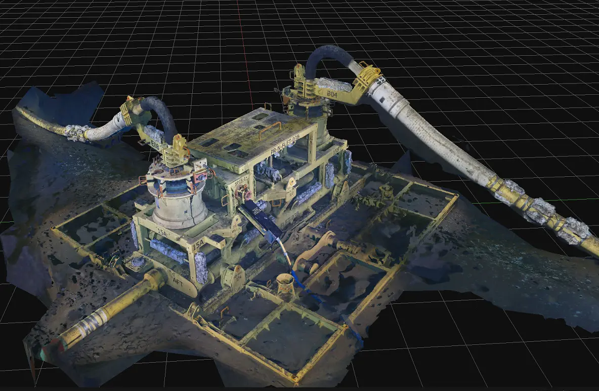 3D model of industrial machinery with pipes and mechanical parts on a grid background.