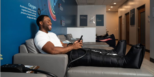 Man gets Compression for recovery I Restore Hyper Wellness