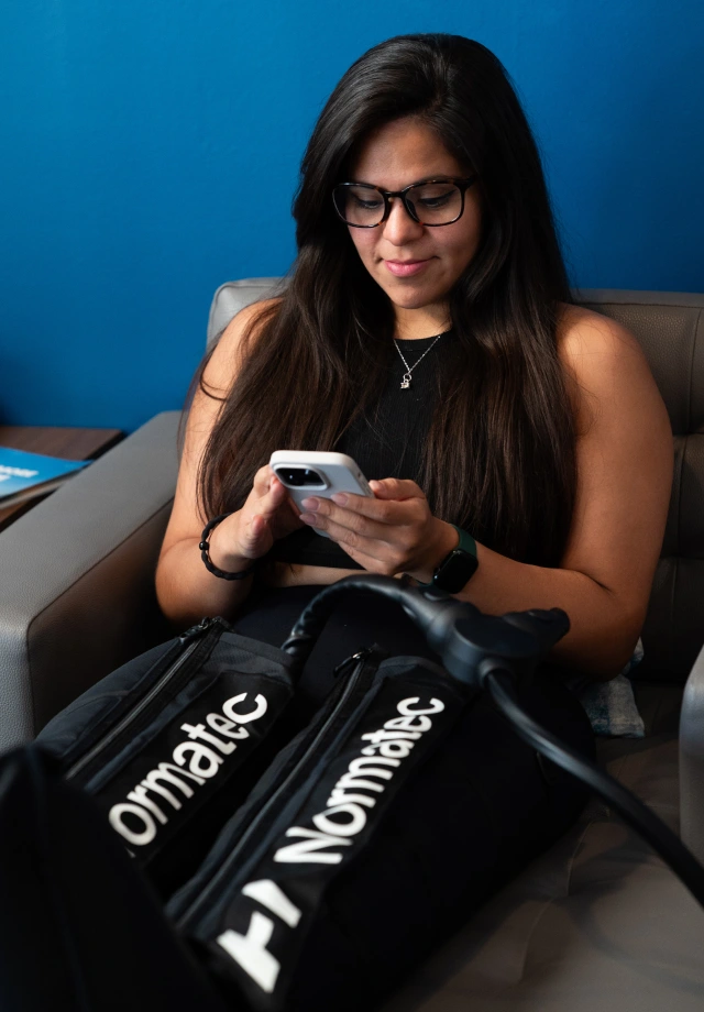 A woman relaxing in Normatex compression boots