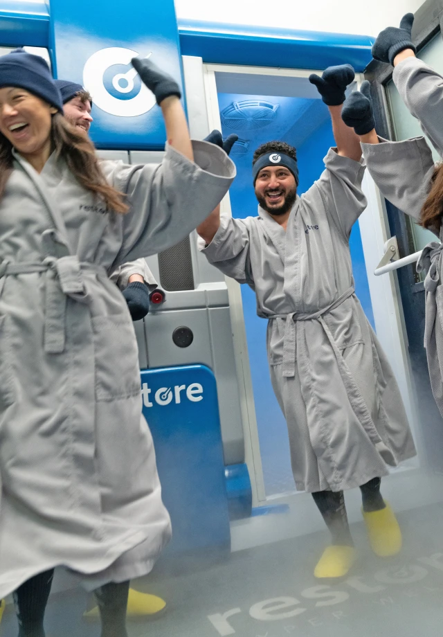 A group of friends exiting a cryotherapy chamber