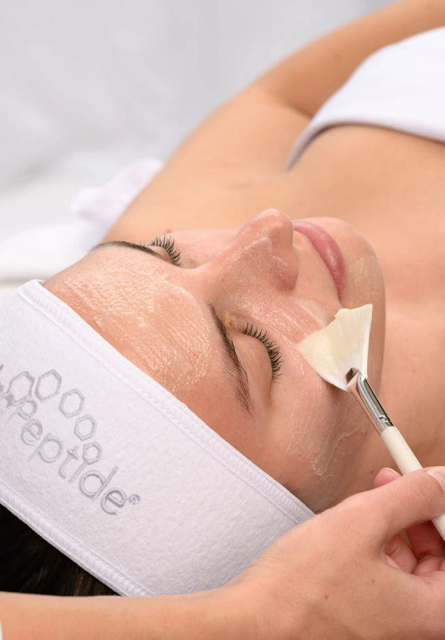 Woman receiving a HydroPeptide HydroGlow Skin Brightening Facial