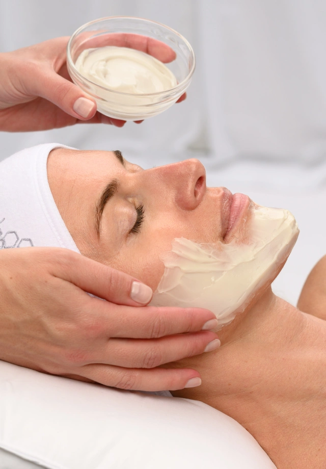 Woman receiving a HydroPeptide Custom Facial