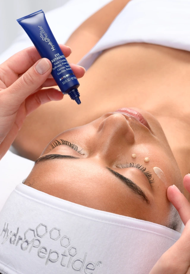A woman receiving a HydroPeptide Oxygen Facial from Restore