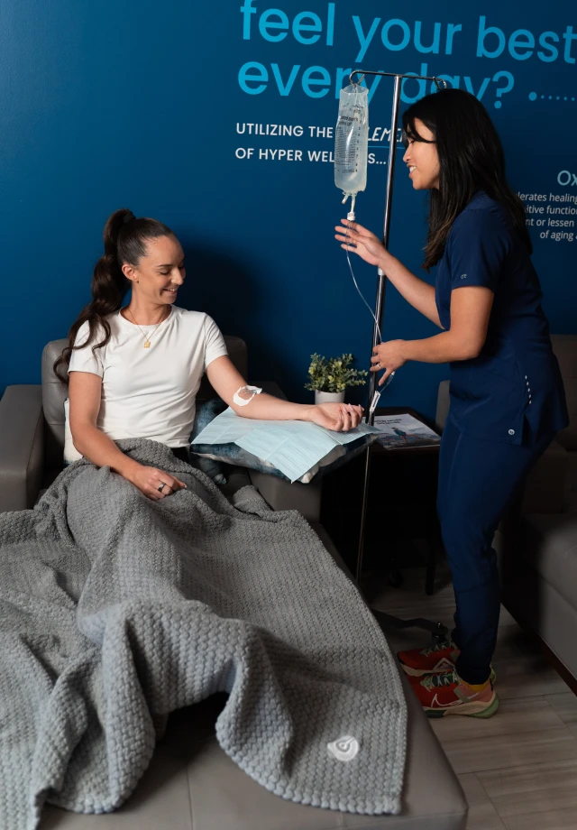 A restore nurse adjust a customer's IV drip
