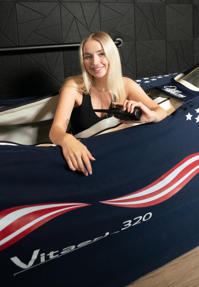 blonde woman exiting a hyperbaric oxygen chamber