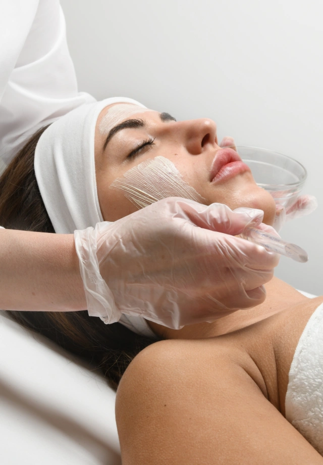 Esthetician applying a Marini peel at Restore Hyper Wellness
