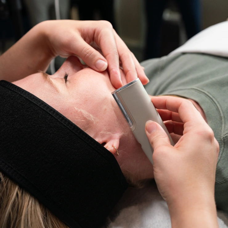 Customer receiving DERMAFLASH LUXE+ Sonic Dermaplaning in West Caldwell, NJ