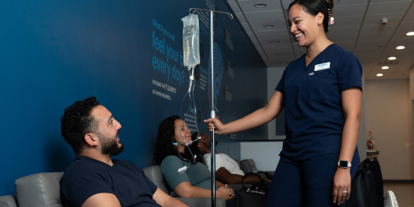 Woman gets NAD+ Therapy at Restore Hyper Wellness