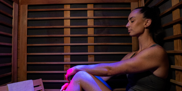 Woman smiles in infared sauna