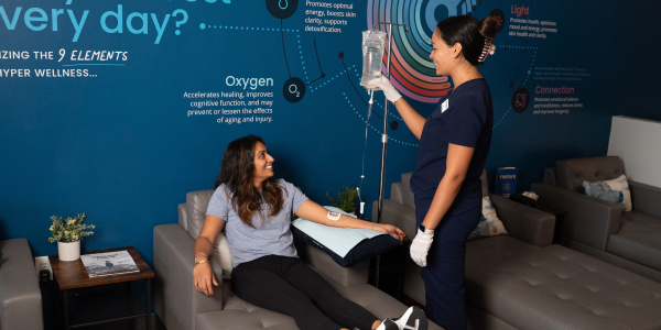 Woman receives IV Drip Therapy at Restore Hyper Wellness