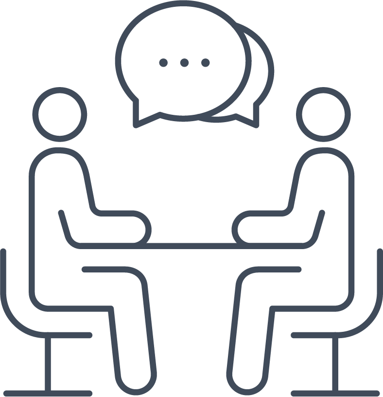 communication icon (two people sitting at a table facing each other)