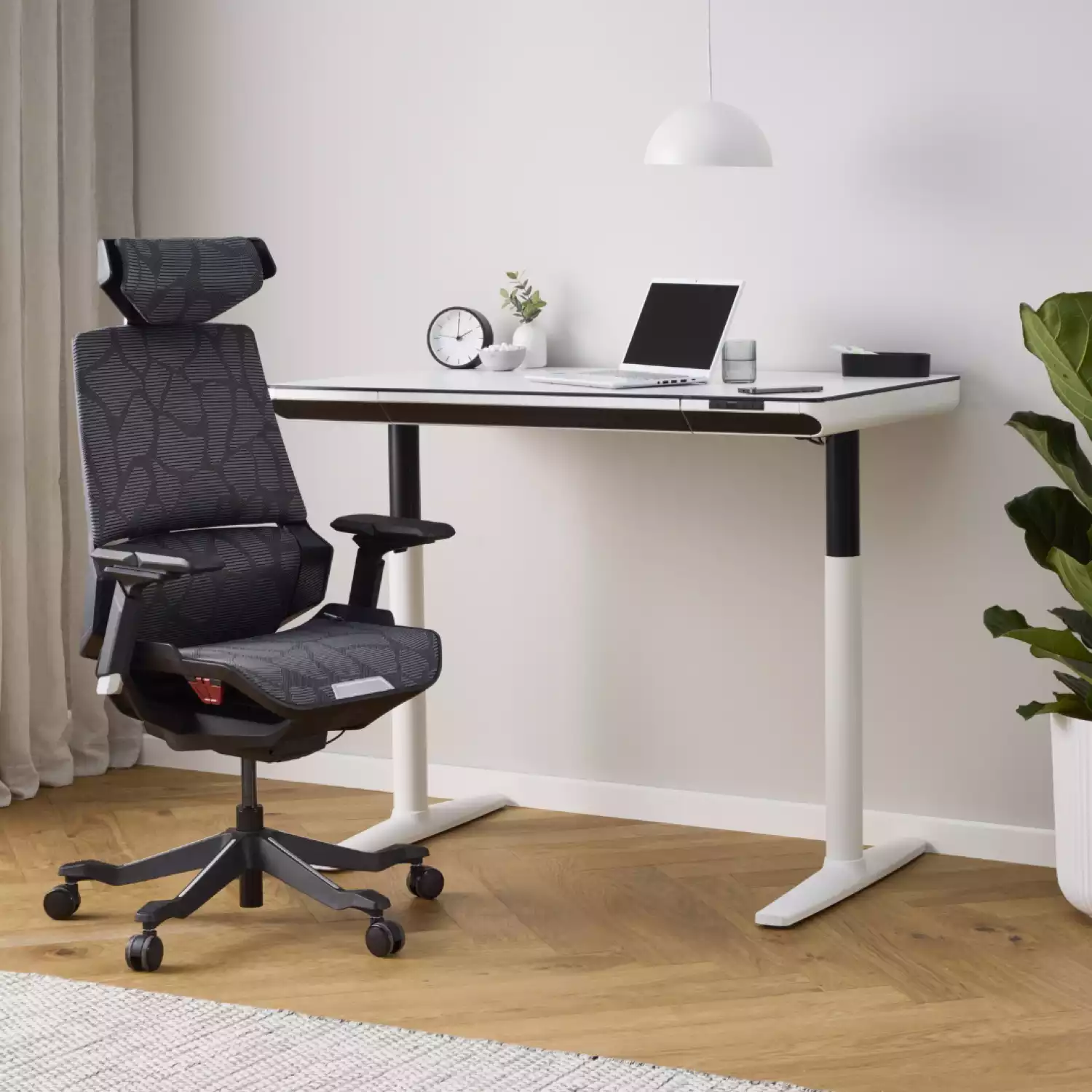 Pago Valkor black gaming chair with ergonomic design, adjustable headrest, lumbar support, and sleek modern styling.