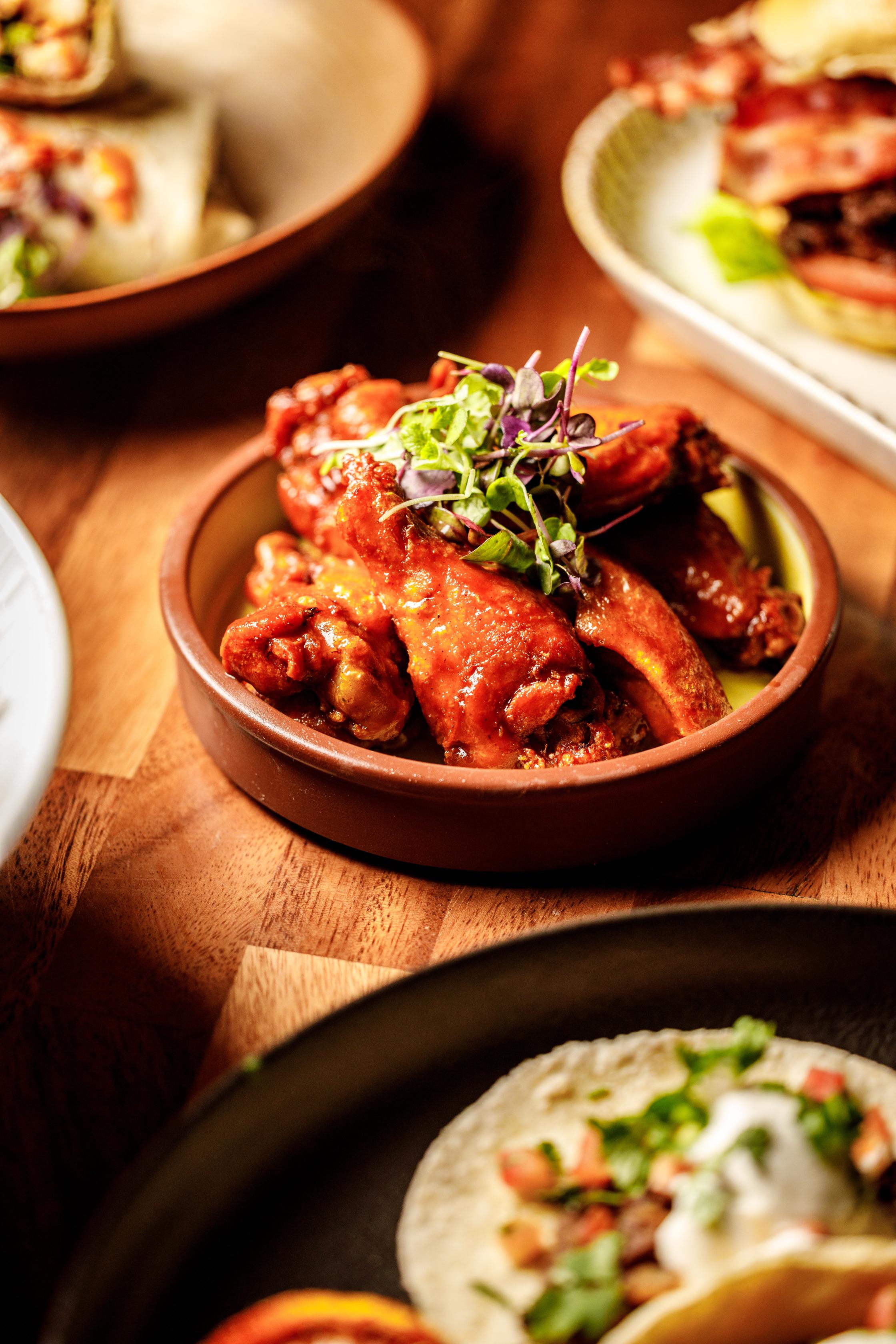 Plan a football watch party in the Bronx with the right screens, seating, food, drinks, arrival time, and group reservation at Playoffs Sports Lounge.