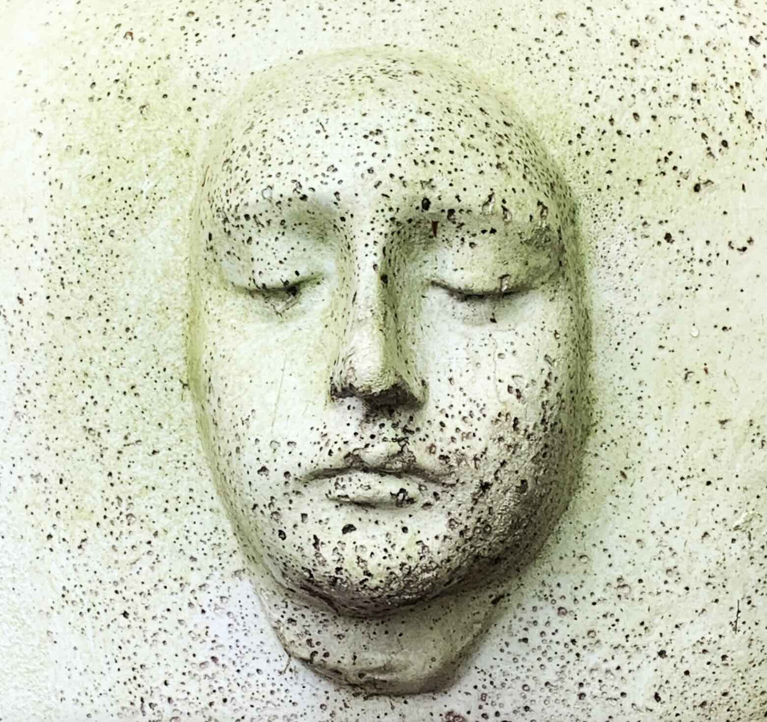 a ceramic face speckled with stars