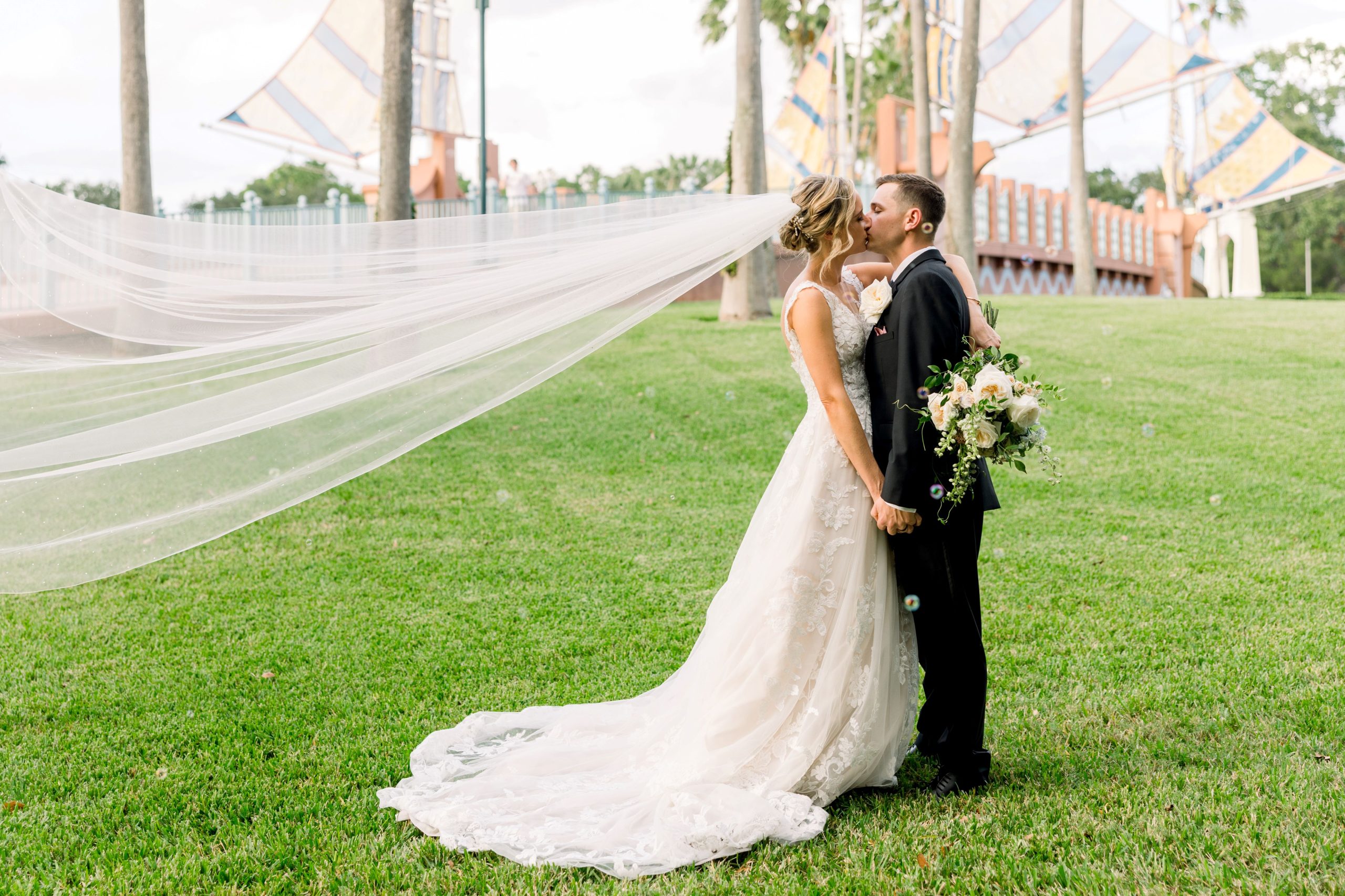 Bride and groom kissing at Disney Swan Hotel