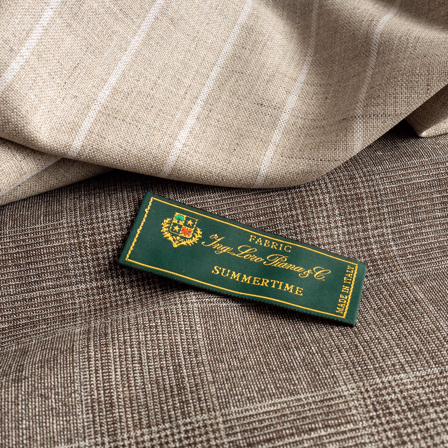 Green fabric label for Summertime collection on textured cloth