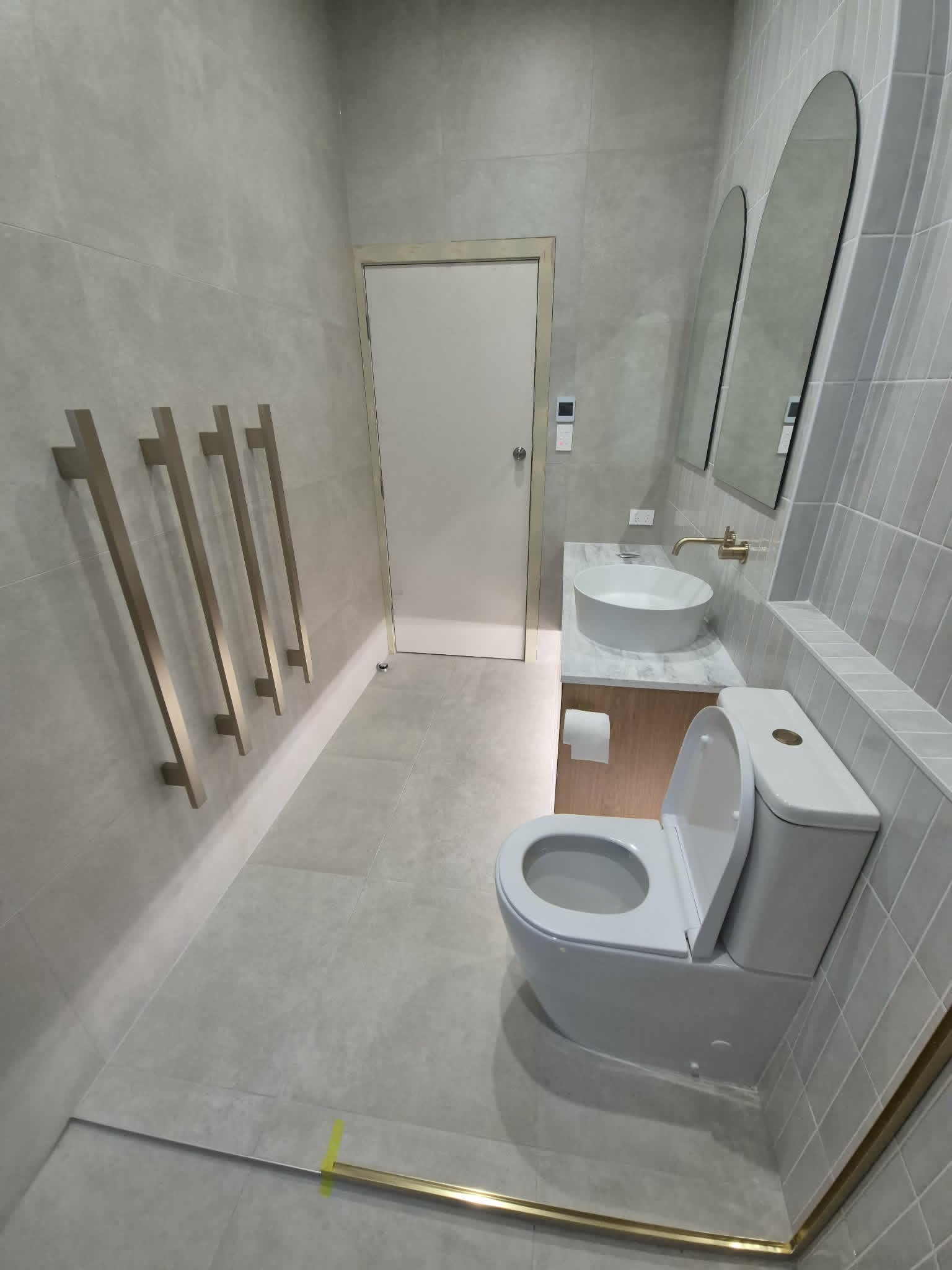 Bathroom lighting and illuminated towel rail installation