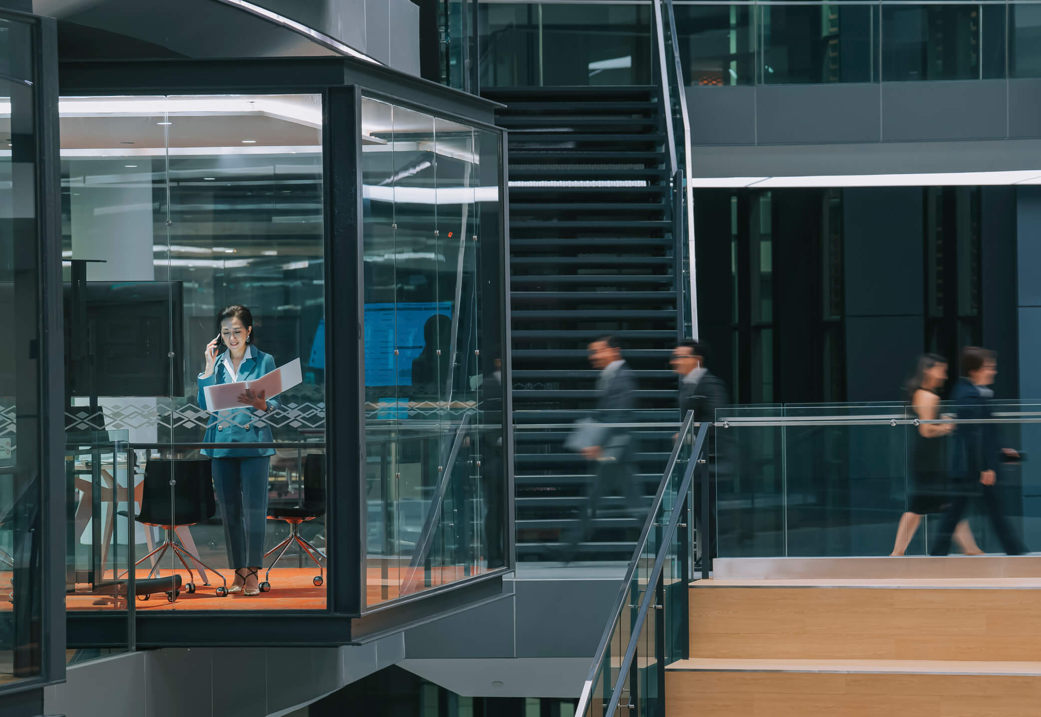 Corporate corridor with people in motion