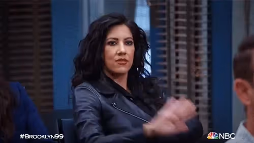 Two women high-fiving.