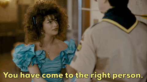 A girl holding a boy's hands and saying, "you've come to the right person."