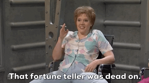 A woman lounging in a chair, holding a cigarette, and saying, "That fortune teller was dead on."