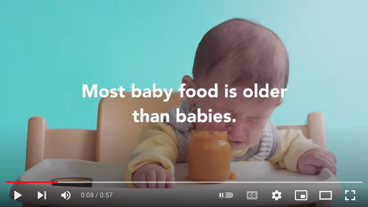 Video screenshot with a crying baby and words: "Most baby food is older than babies."