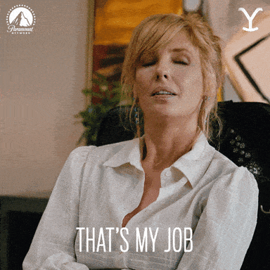 A woman in a desk chair saying, "That's my job."