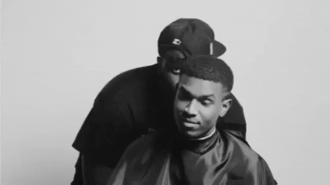Identity gif - barber peaking over customer's head