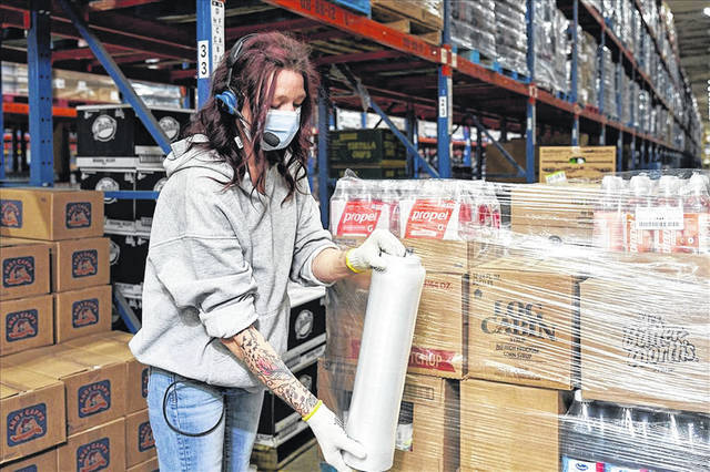 A SpartanNash employee packing goods
