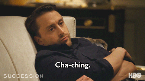 A man lounging in a chair and saying, "Cha-ching."