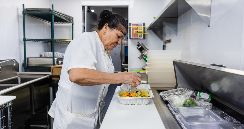 chef preparing food in modular kitchen 