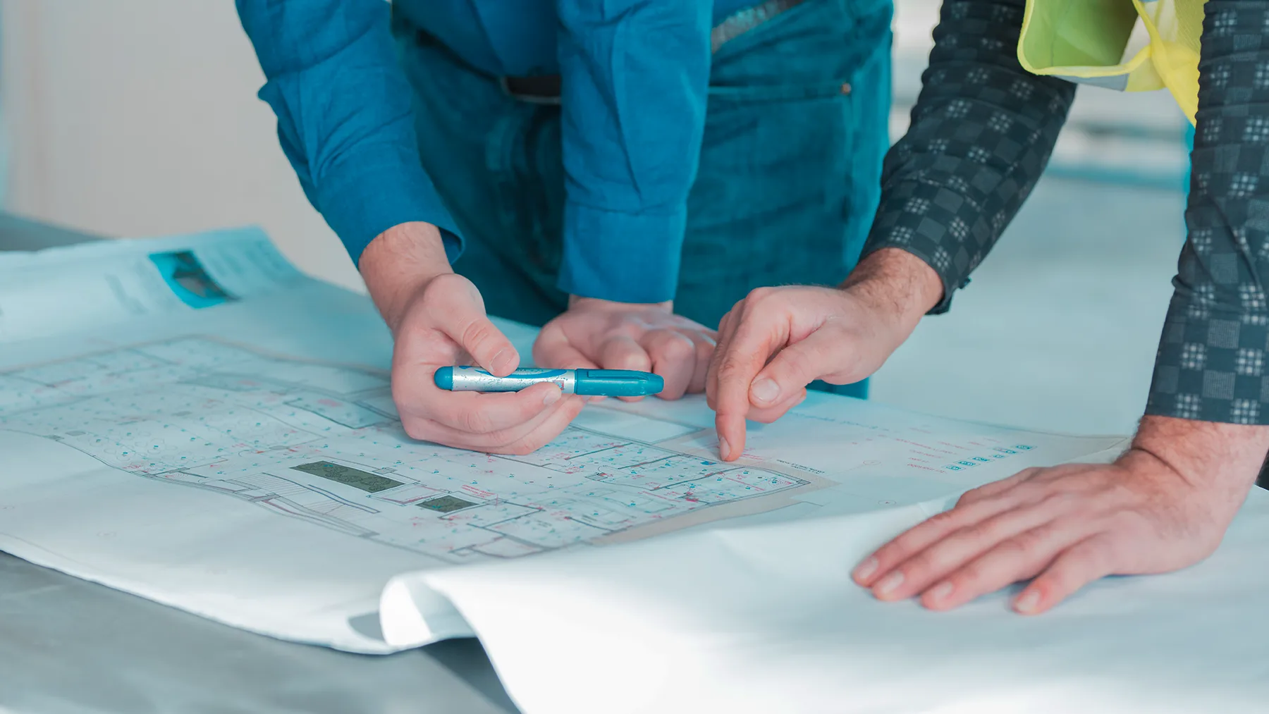 Renew Air technician reviewing building plans for a new home air conditioning installation in Port Macquarie