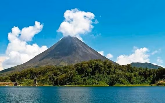 A lake with a mountain in the background. AI-generated content may be inaccurate.