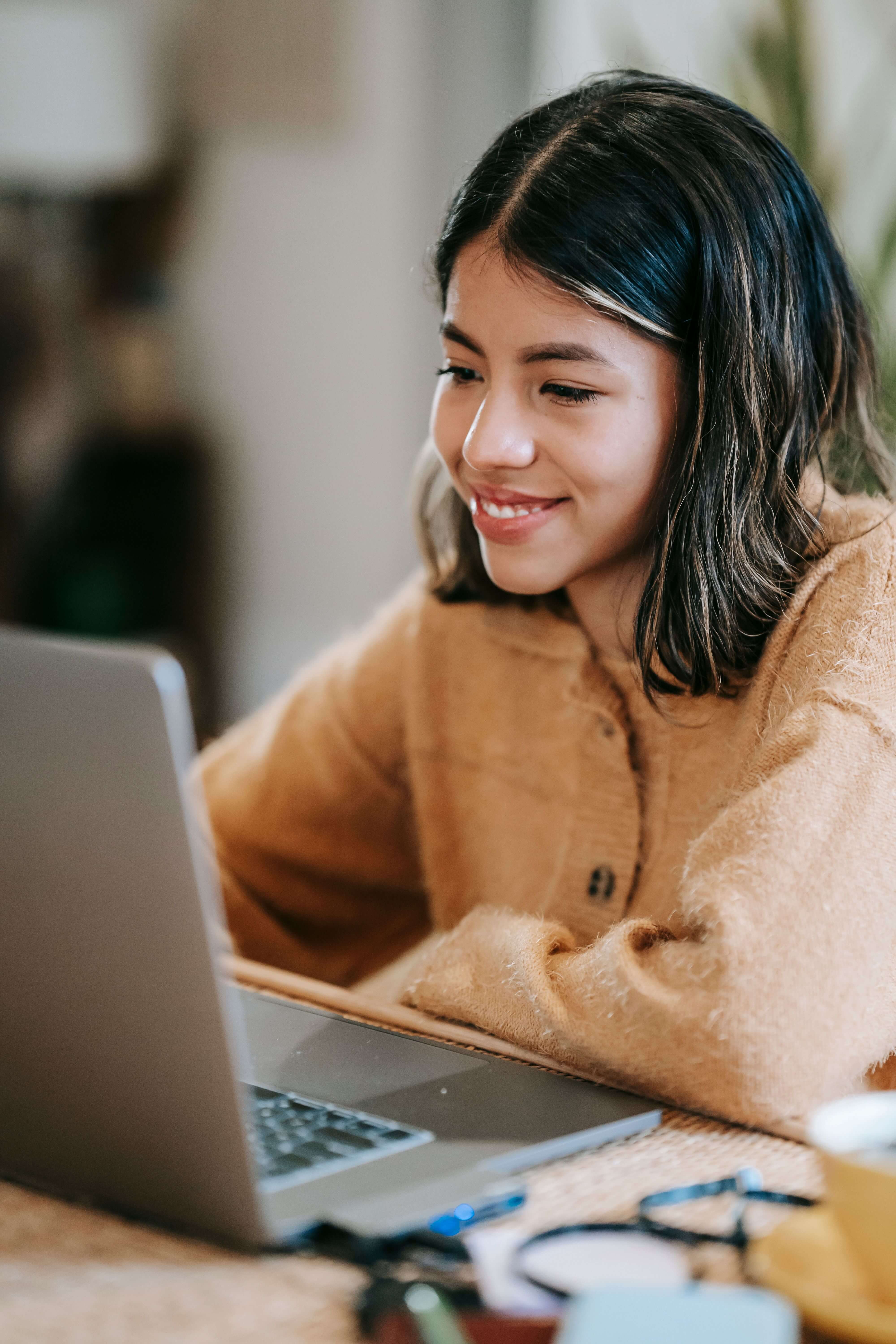 Woman engaging in online therapy session from home with a licensed Grouport therapist