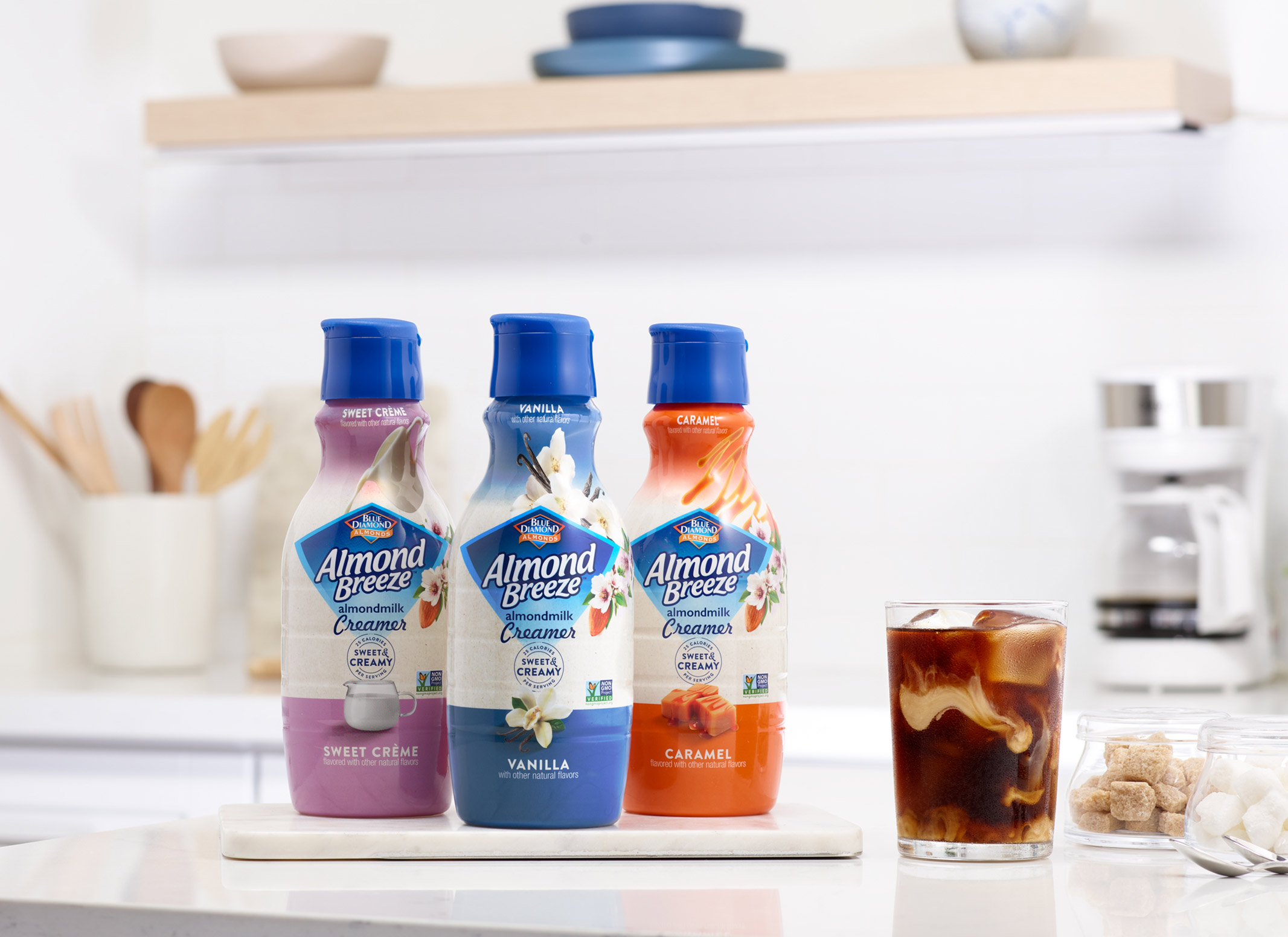 three different Coffee Creamers in kitchen with cold brew