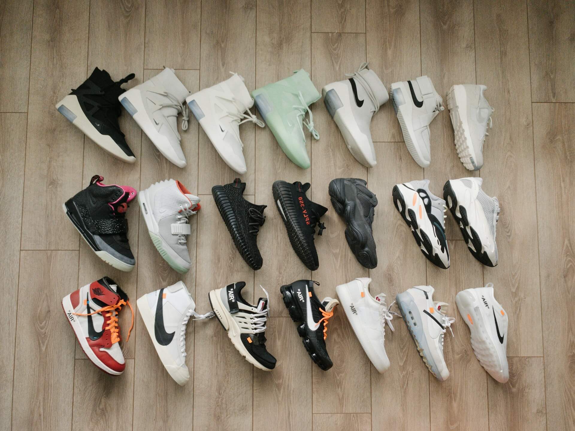 Many different sneakers on the floor
